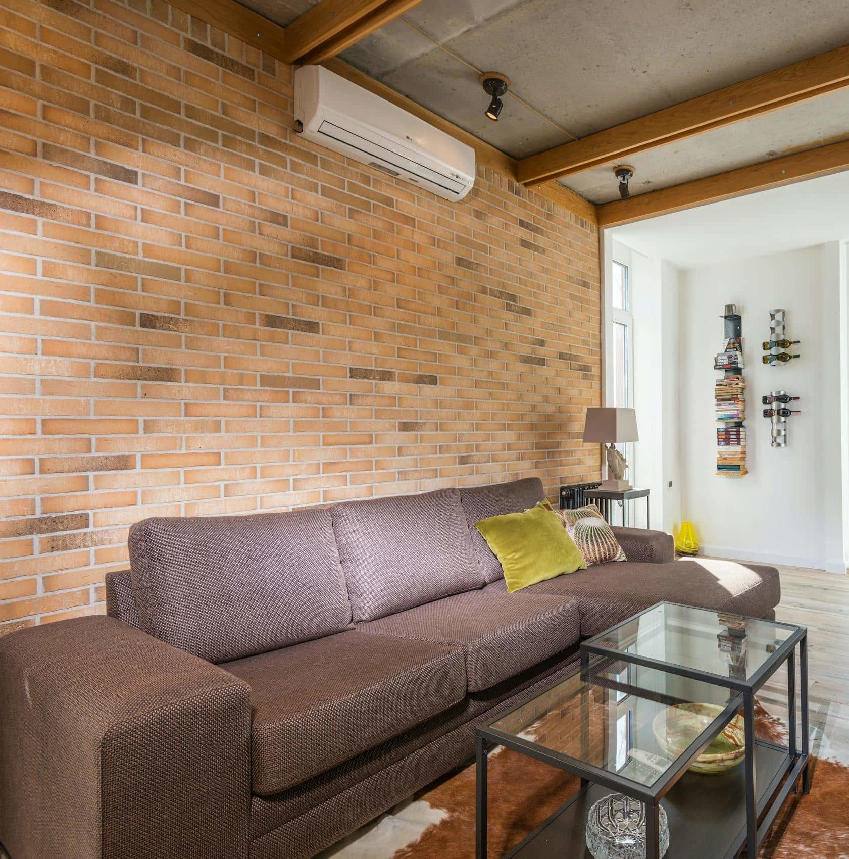 Living Room with Natural Light Through the Full Wall Glass Panels